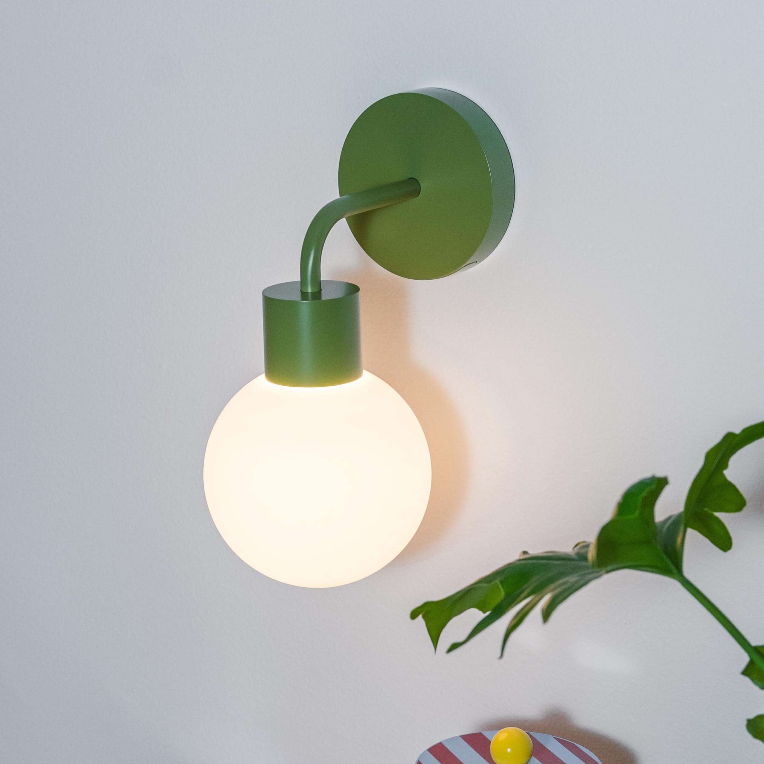Poplight rechargeable wall sconce mounted beside a shelf